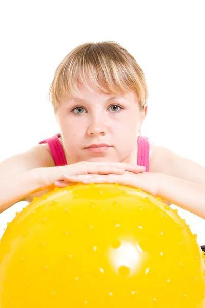 Teenager with a ball on a white background. — Stock Photo, Image