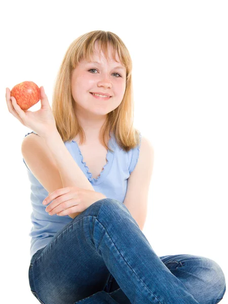 Menina com uma maçã em um fundo branco . — Fotografia de Stock