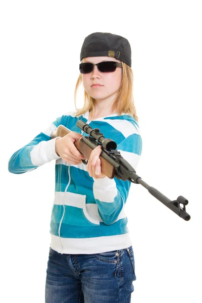 Une adolescente avec une arme sur fond blanc . — Photo