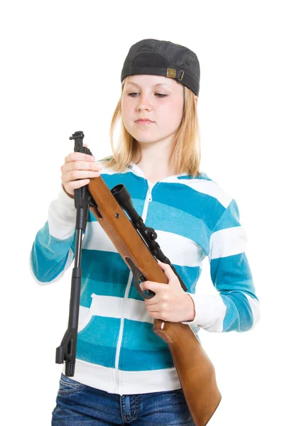 Um adolescente com uma arma em um fundo branco . — Fotografia de Stock