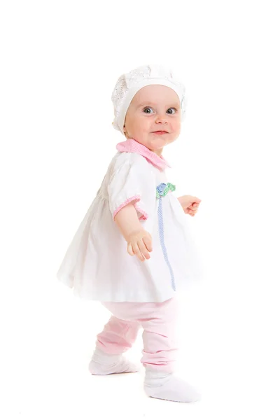 Bébé en robe sur fond blanc . — Photo