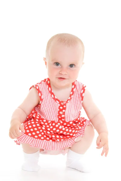 Baby i klänning på en vit bakgrund. — Stockfoto