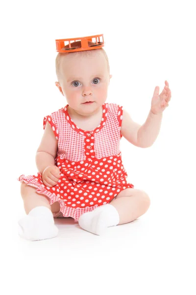 Baby in jurk op een witte achtergrond. — Stockfoto
