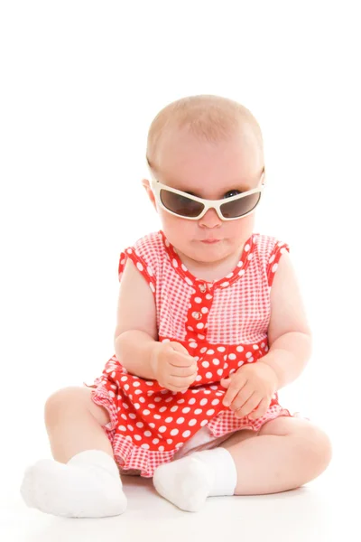 Baby in dress on a white background. Stock Picture