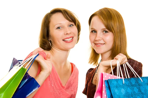 Chicas con compras sobre fondo blanco . —  Fotos de Stock