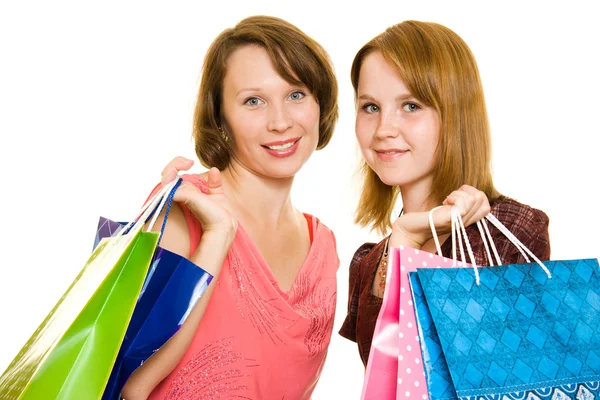 Chicas con compras sobre fondo blanco . — Foto de Stock