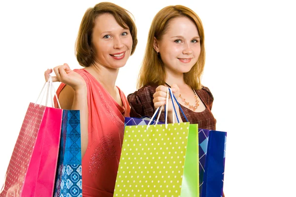Chicas con compras sobre fondo blanco . —  Fotos de Stock