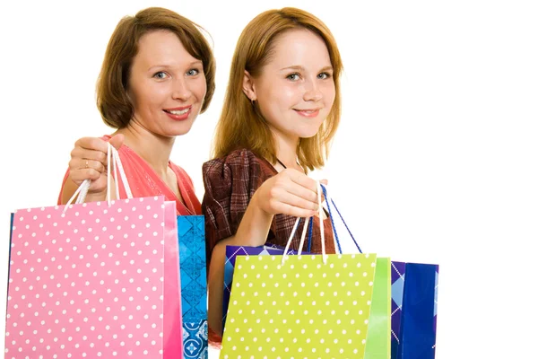 Ragazze con shopping su sfondo bianco . — Foto Stock