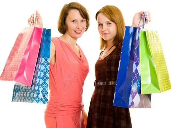 Chicas con compras sobre fondo blanco . — Foto de Stock