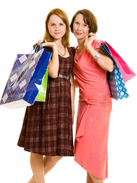 Meninas com compras em fundo branco . — Fotografia de Stock