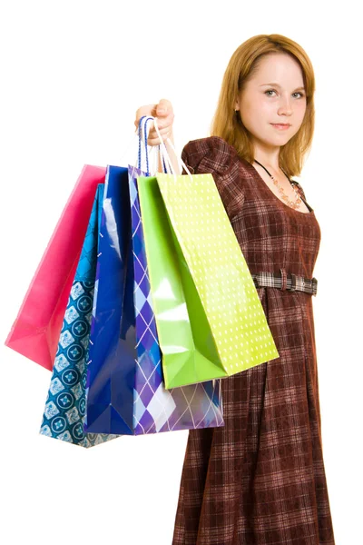 Chica con compras sobre fondo blanco . — Foto de Stock