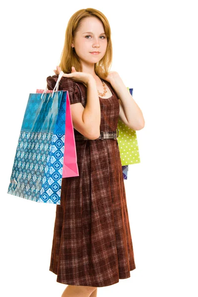 Flicka med shopping på vit bakgrund. — Stockfoto