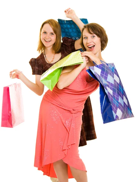 Τα κορίτσια με τα ψώνια για το λευκό φόντο. — Φωτογραφία Αρχείου