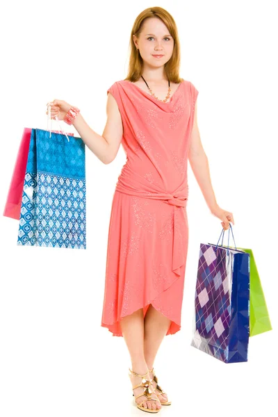 Menina com compras em fundo branco . — Fotografia de Stock