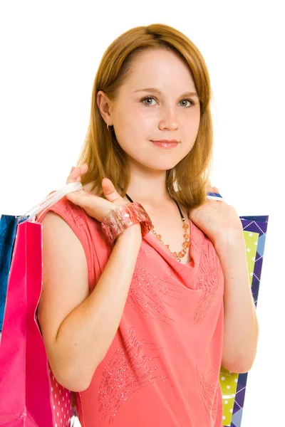 Mädchen mit Shopping auf weißem Hintergrund. — Stockfoto