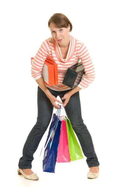 Ragazza con lo shopping su sfondo bianco . — Foto Stock