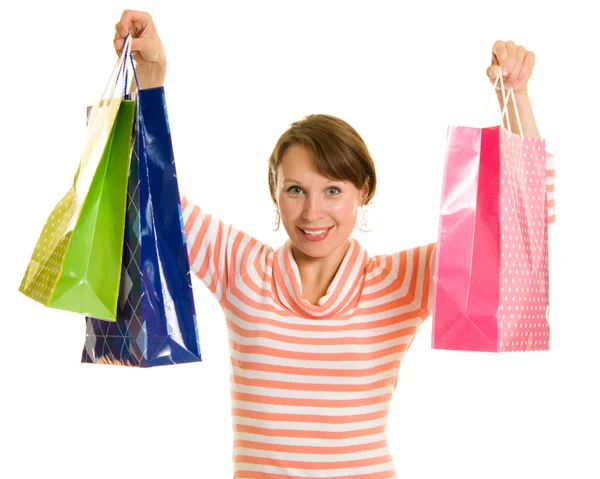 Menina com compras em fundo branco . — Fotografia de Stock