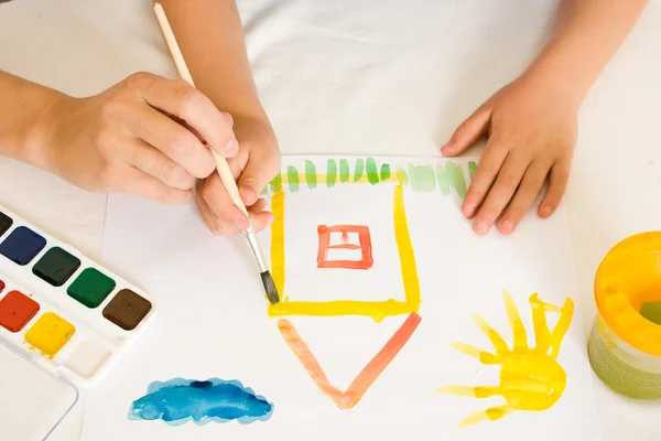 stock image Child with paint on a white background.