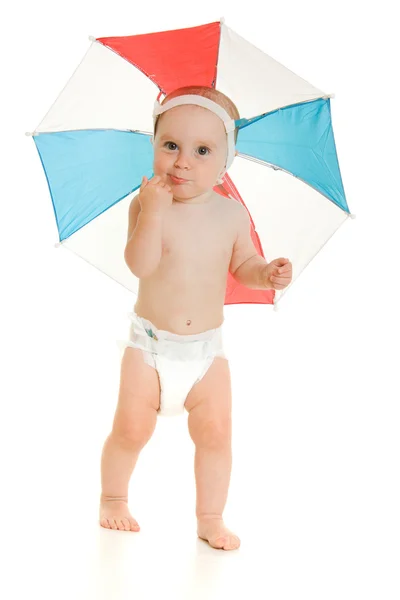 The kid with an umbrella on his head. — Stock Photo, Image