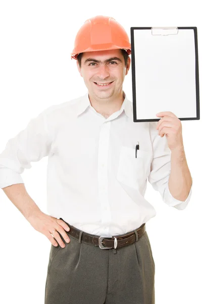 Empresário em capacete segurando um tablet . — Fotografia de Stock