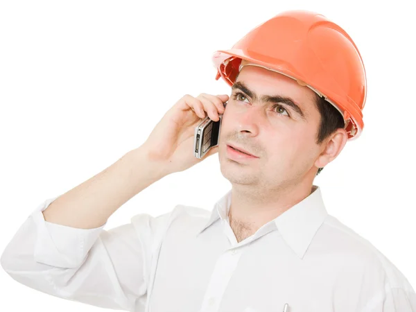 Businessman in helmet on the phone. — Stock Photo, Image