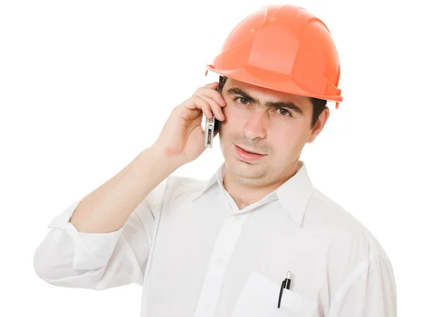 Businessman in helmet on the phone. — Stock Photo, Image