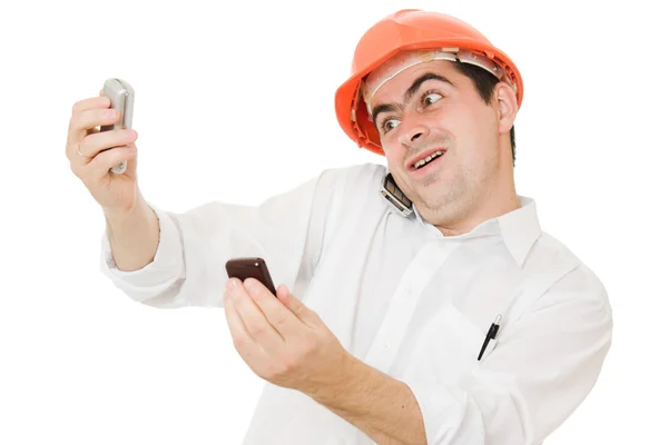 휴대 전화에 그의 헬멧에 미친 사업가. — 스톡 사진