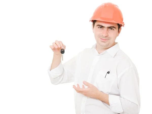 Businessman with a key in the helmet. — Stock Photo, Image