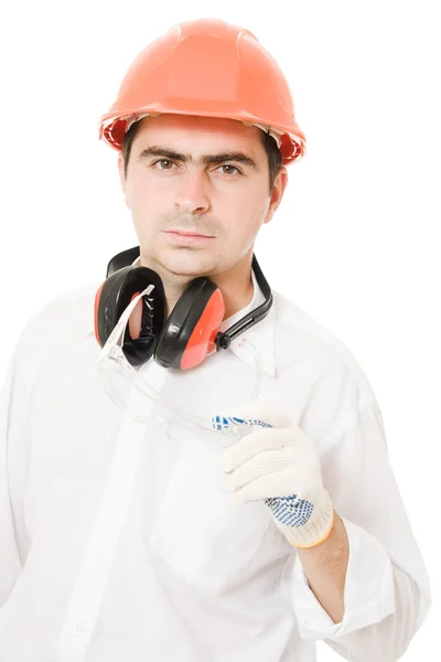 Empresário em um capacete em um fundo branco . — Fotografia de Stock