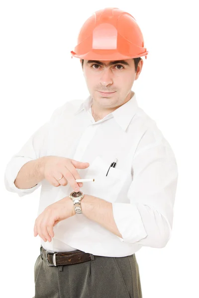 Uomo d'affari in un casco con una sigaretta . — Foto Stock