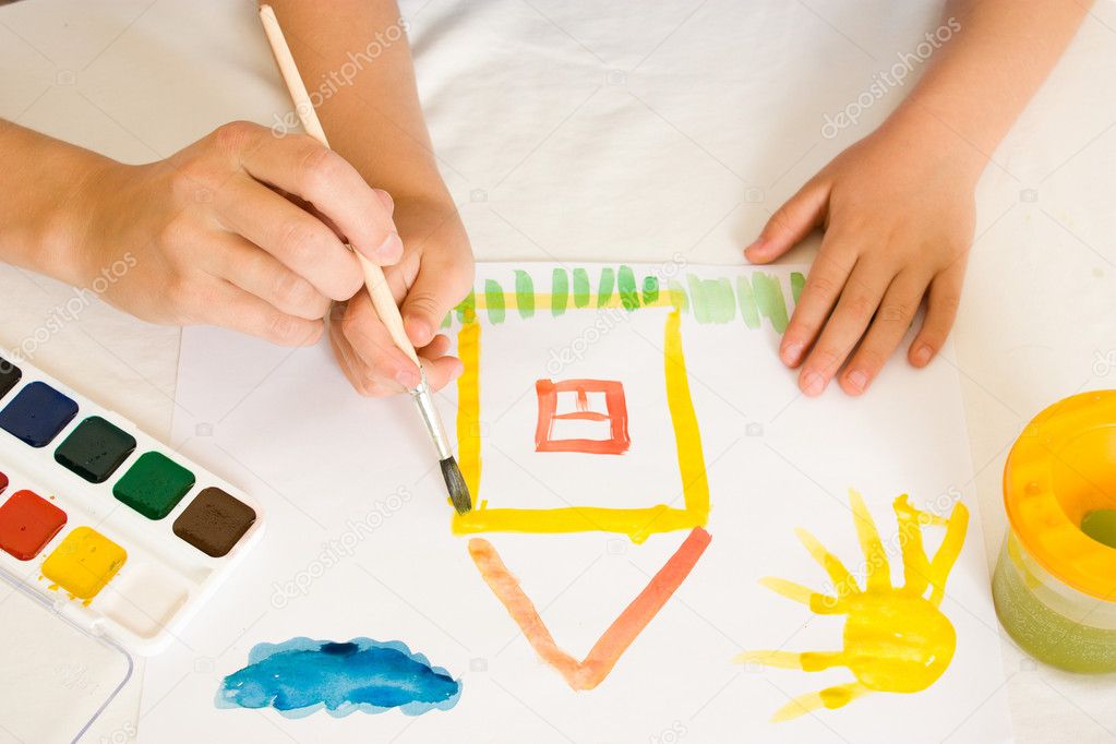 Child with paint on a white background.