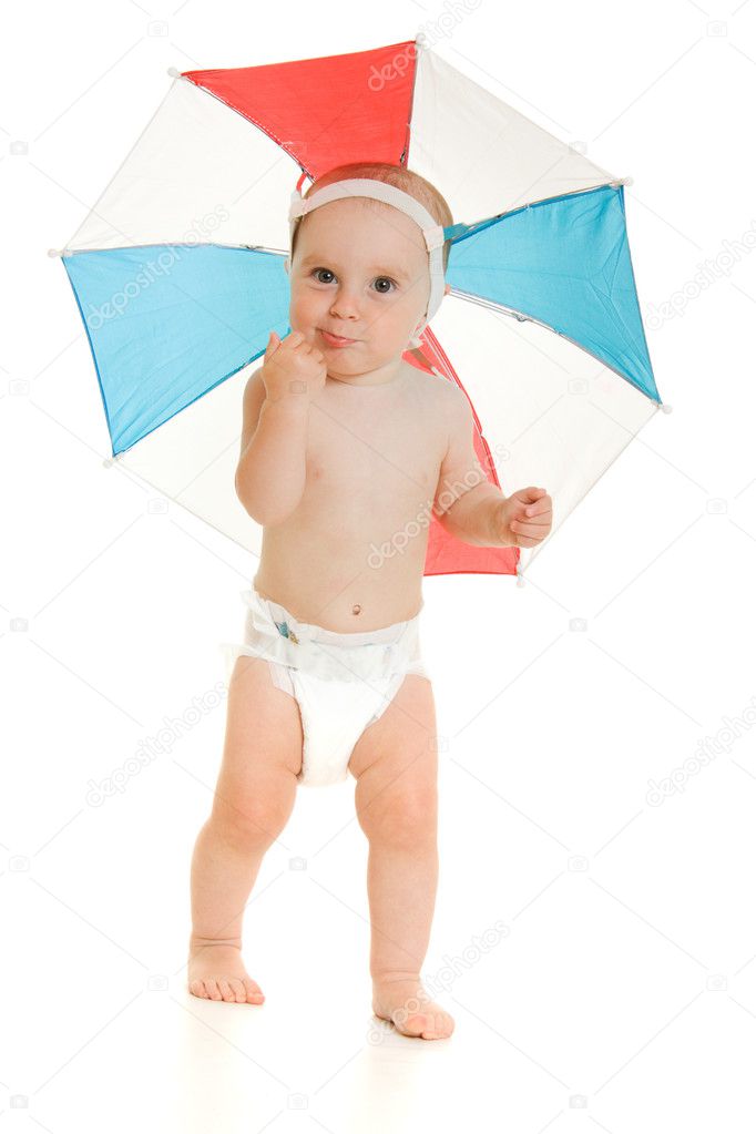 The kid with an umbrella on his head.