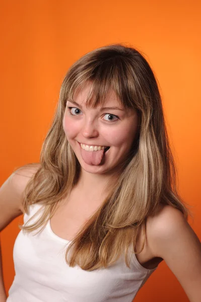 Girl put out her tongue — Stock Photo, Image