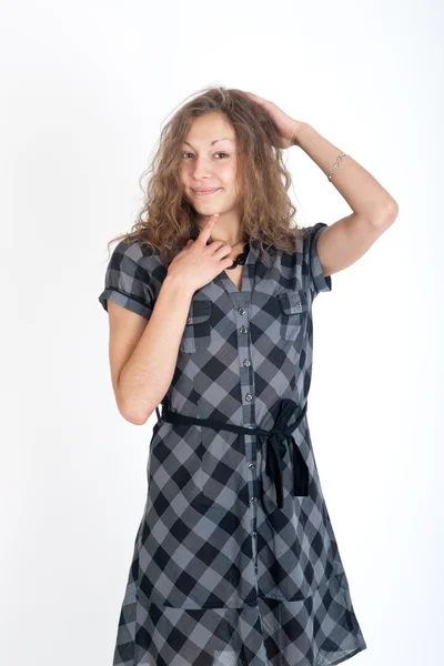 Meisje in een geruite jurk — Stockfoto