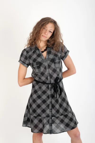 Menina em um vestido xadrez — Fotografia de Stock