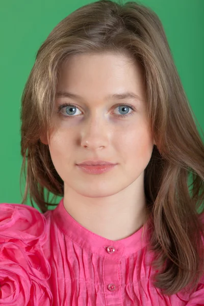 Het meisje in een roze blouse — Stockfoto