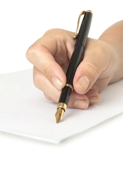 Mano con pluma escribiendo en la página blanca — Foto de Stock