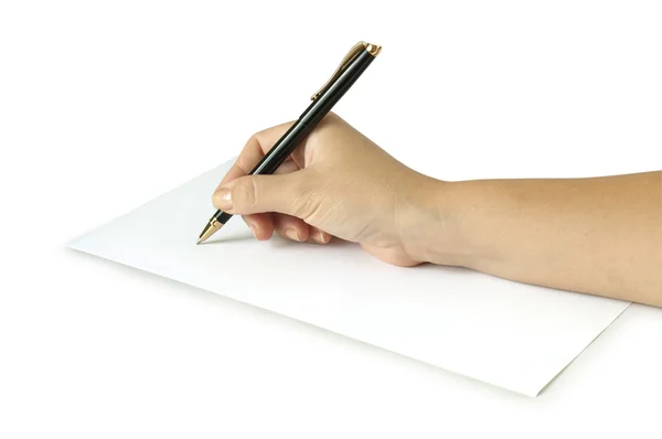 Рука с ручкой на белой странице — стоковое фото