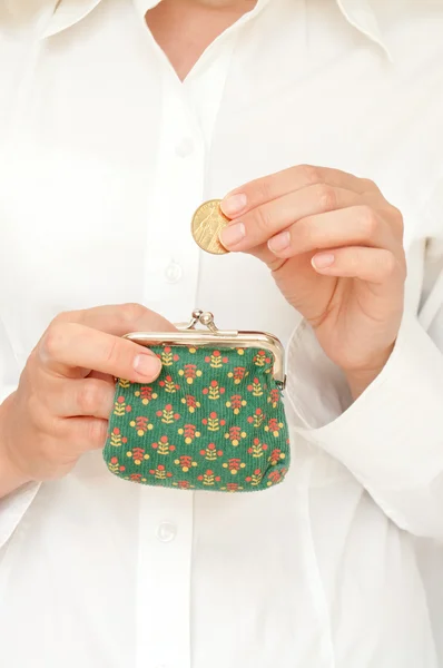 Hand put coin in purse — Stock Photo, Image