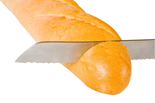 Knife cuts bread — Stock Photo, Image