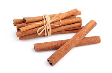 Bunch of cinnamon sticks isolated on white clipart