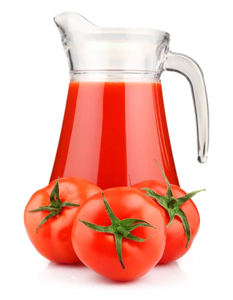 stock image Jug of tomato juice and fruits with green leaves isolated