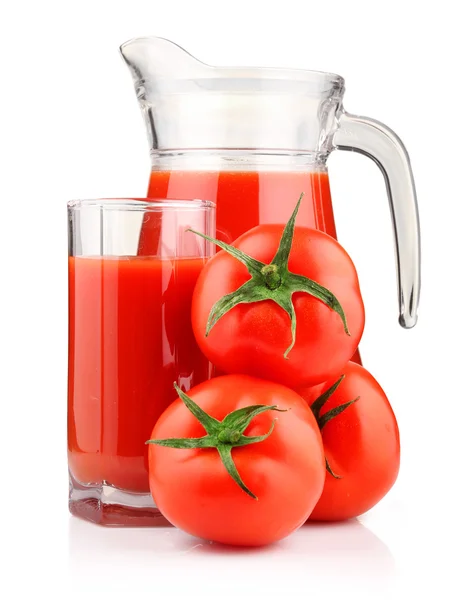 stock image Jug, glass of tomato juice and fruits with green leaves isolated