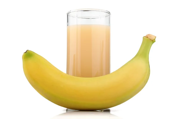 Full glass of banana juice and fruits isolated — Stock Photo, Image
