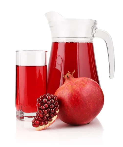 Jug and glass of pomegranate juice with fruits isolated — Stock Photo, Image