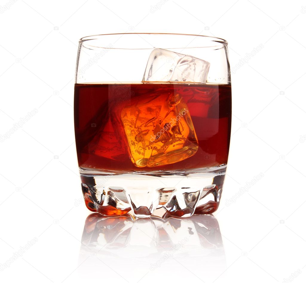 Glass of whiskey with ice cubes isolated