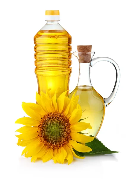 Jarra y botella de aceite de girasol con flor aislada — Foto de Stock