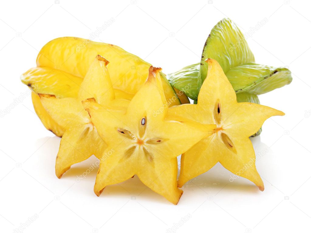 Carambola fruit with slices isolated on white
