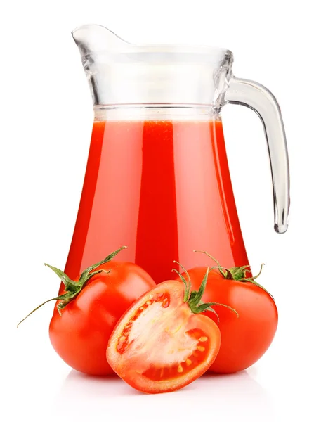 stock image Jug of tomato juice and fruits with green leaves isolated