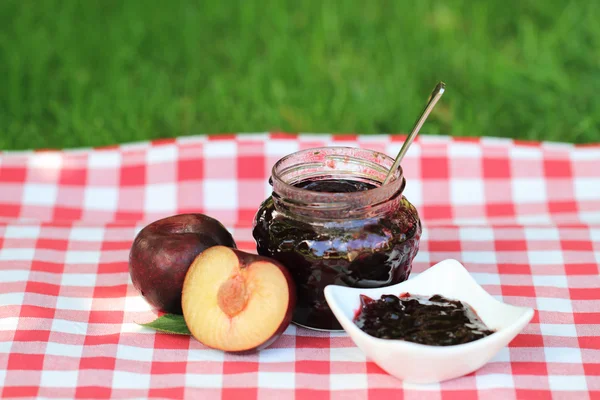 Jar of plum jam — Stock Photo, Image